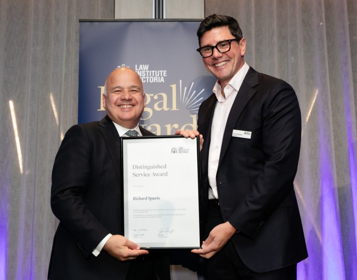 Richard Spurio receiving a Distinguished Service Award from Tom Ballantyne (president, Law Institute of Victoria
