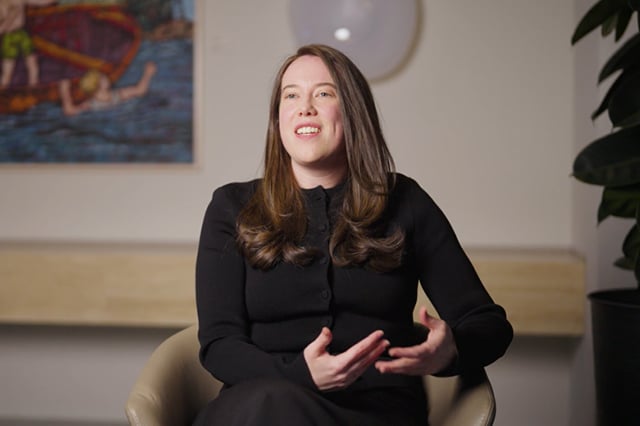 Lauren John wearing a black top seated in the Allens office.